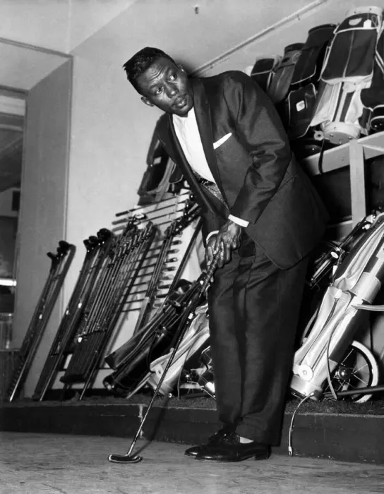 Framed Print : Joey Brown tries out golf clubs at a big London departmental store (Selfridges)