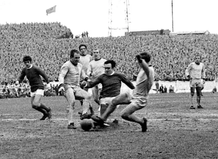 Framed Print : John Aston of Manchester United takes the ball between Maurice Setter (left