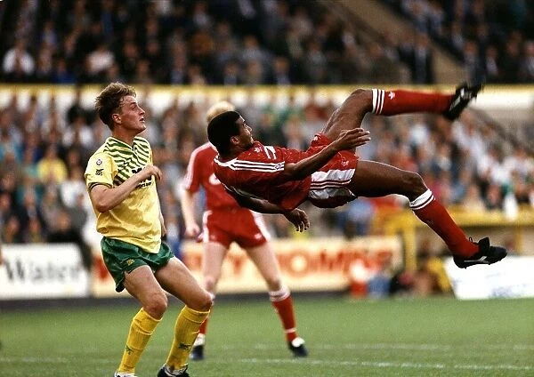 John Barnes of Liverpool FC tries a spectacular overhead kick watched by Norwich City