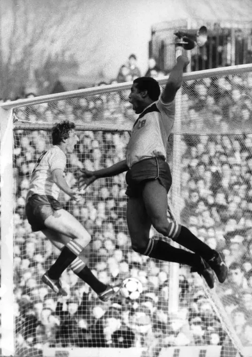 Framed Print : John Barnes of Watford leaps high into the air as he celebrates his second goal against Framed Print : John Barnes of Watford leaps high into the air as he celebrates his second goal against