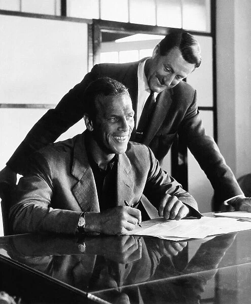 John Charles signs for Cardiff watched by manager George Swindon following his transfer