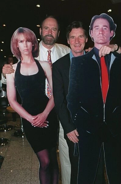 John Cleese and Michael Palin with cardboard cut-outs of Jamie Lee-Curtis