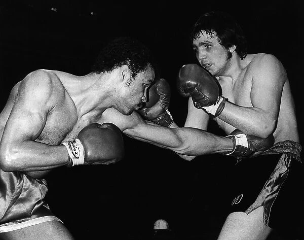 John Conteh Boxer throws a body punch to Les Stevens during their Fight