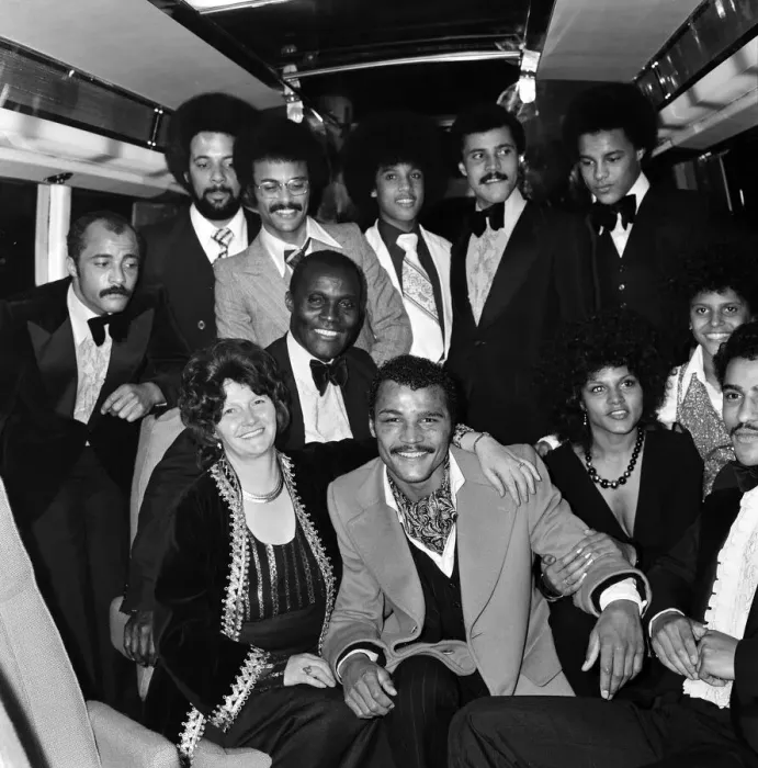 Framed Print : John Conteh celebrates with family aboard a playboy motor coach after winning world title Framed Print : John Conteh celebrates with family aboard a playboy motor coach after winning world title