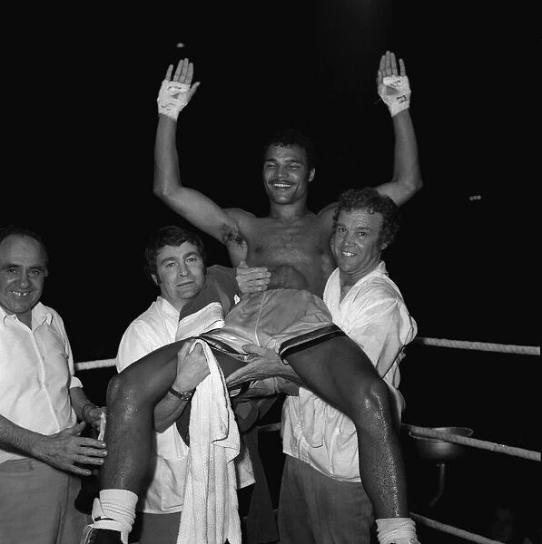 John Conteh is lifted in the air after beating Chris Finnigan