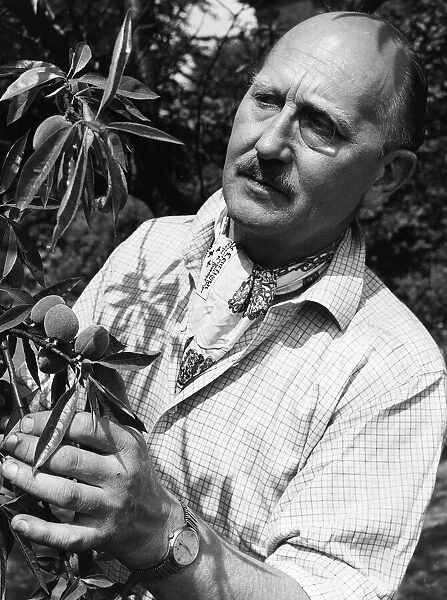 John Cradock husband of television chef Fanny Cradock, pictured in the garden of their