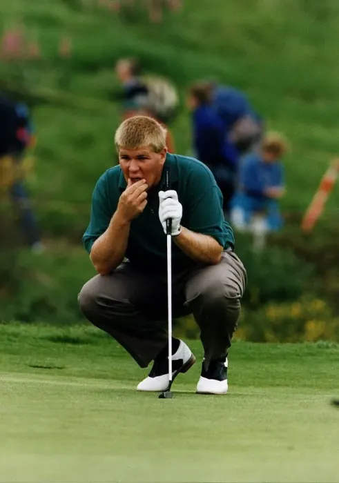 Framed Print : John Daly kneels to contemplate shot holding putter golf Scottish Open at Gleneagles Framed Print : John Daly kneels to contemplate shot holding putter golf Scottish Open at Gleneagles