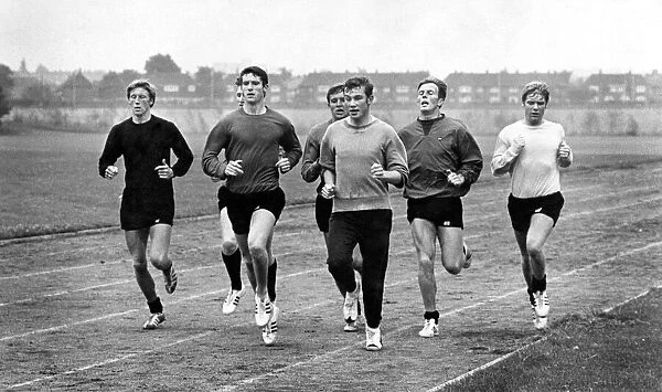 John Davies (centre) leads the Manchester City players in their training stint