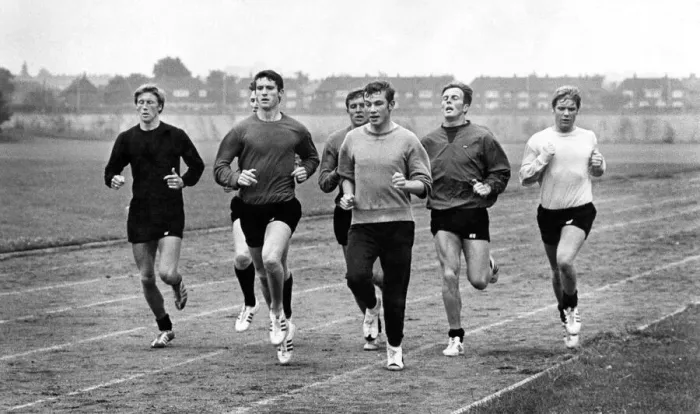 Framed Print : John Davies (centre) leads the Manchester City players in their training stint