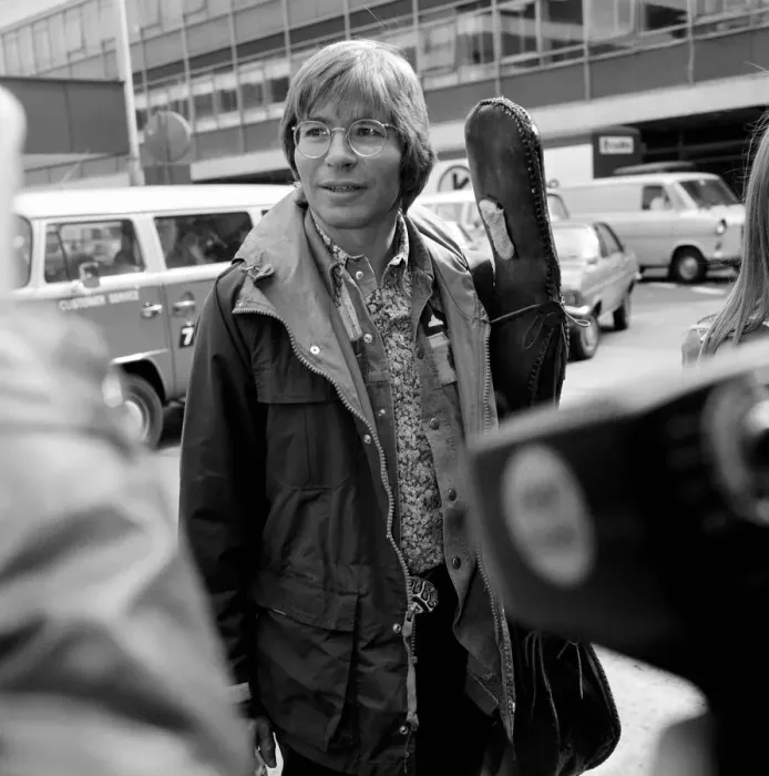 Framed Print : John Denver: U. S. singer seen here at London Airport with his guitar. April 1976 Framed Print : John Denver: U. S. singer seen here at London Airport with his guitar. April 1976