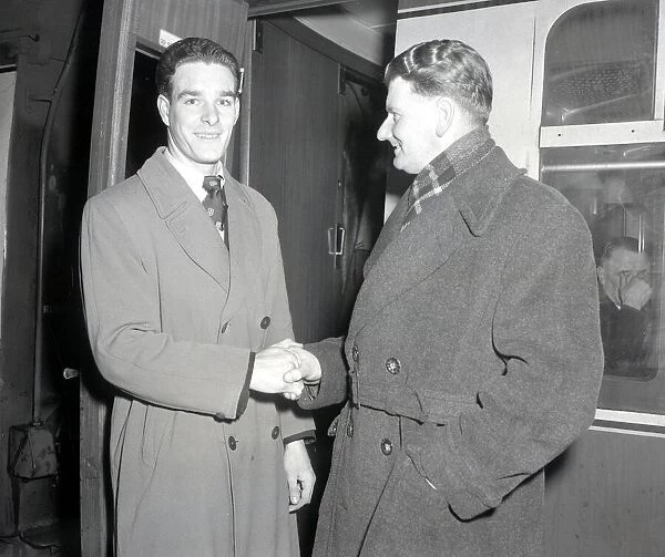 John Edward Lever (Right) at Euston Station en route to Bolton shaking hands with unnamed
