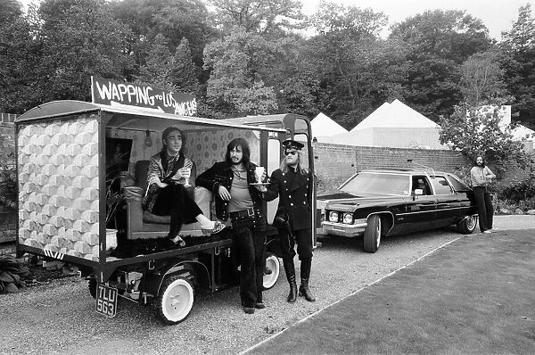 John Entwistle and Keith Moon of the rock group The Who show off their new cars at