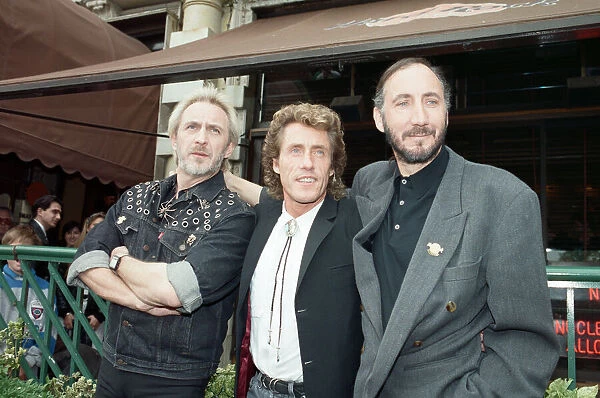 John Entwistle, Pete Townshend and singer Roger Daltrey of The Who rock group pat