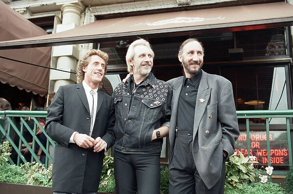 John Entwistle, Pete Townshend and singer Roger Daltrey of The Who rock group pat