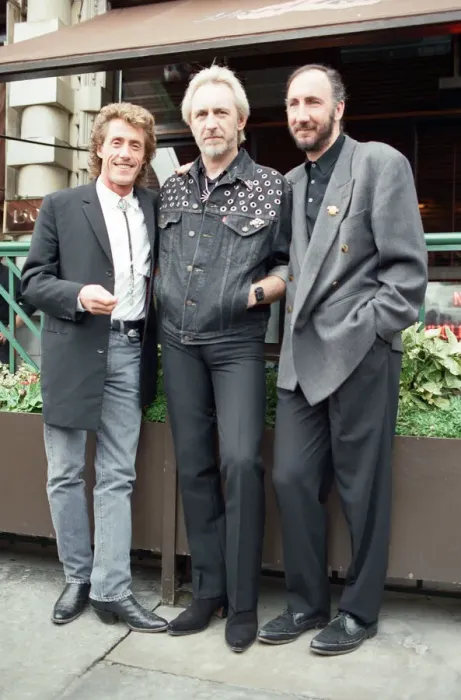 Framed Print : John Entwistle, Pete Townshend and singer Roger Daltrey of The Who rock group pat