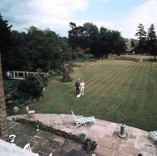 John and Fanny Cradock on the lawn at the rear of their new home near Watford