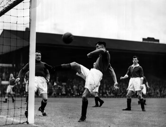 Framed Print : John Griffiths of Manchester United relieves pressure with an overhead clearance during Framed Print : John Griffiths of Manchester United relieves pressure with an overhead clearance during