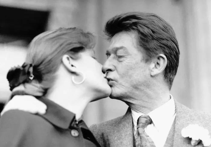 Framed Print : John Hurt British film actor kisses his new bride 1990
