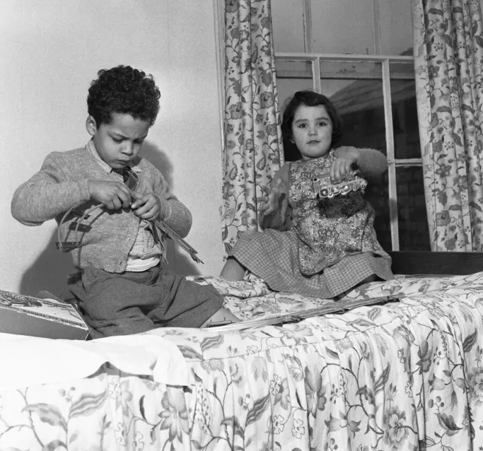 Framed Print : John Johnson (left) aged five plays with his train set with Elizabeth Milland in Framed Print : John Johnson (left) aged five plays with his train set with Elizabeth Milland in