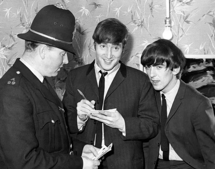 Framed Print : John Lennon and George Harrison sign an autograph for PC T Framed Print : John Lennon and George Harrison sign an autograph for PC T