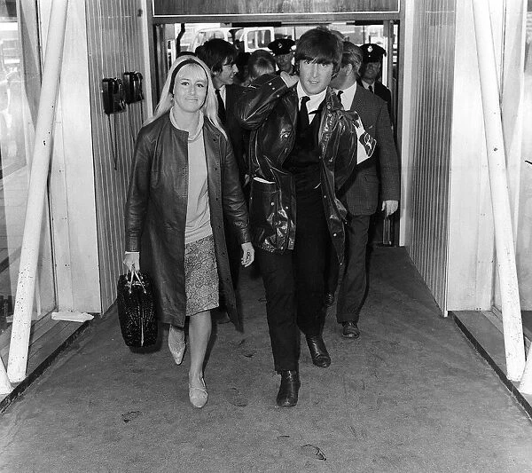 John Lennon and his girlfriend Cynthia May 1964 at Heathrow Airport