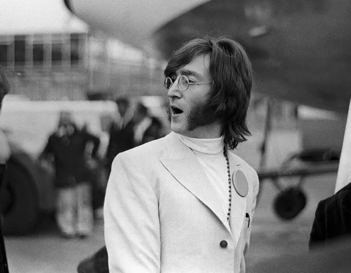 Framed Print : John Lennon at Heathrow Airport off to India, February 1968 Framed Print : John Lennon at Heathrow Airport off to India, February 1968