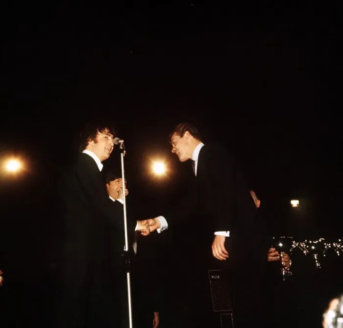 Framed Print : John Lennon and Paul McCartney of The Beatles receiving awards from Roger Moore