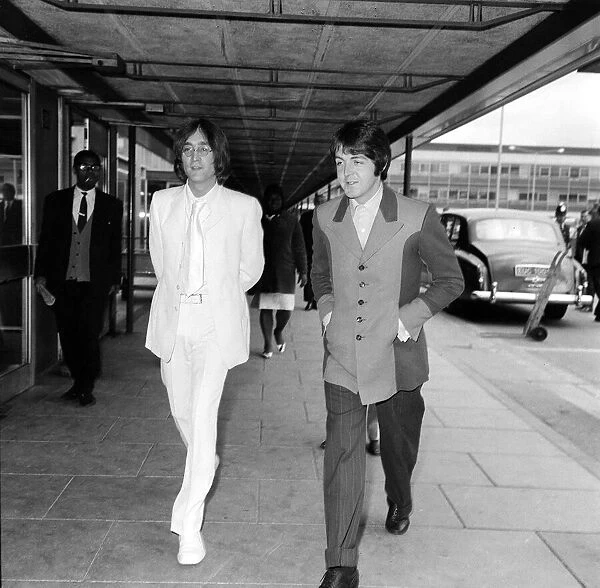 John Lennon and Paul McCartney fly from Heathrow Airport to New York to discuss