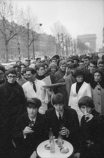 John Lennon, Paul McCartney and George Harrison bring the Champs-Elysees to a standstill