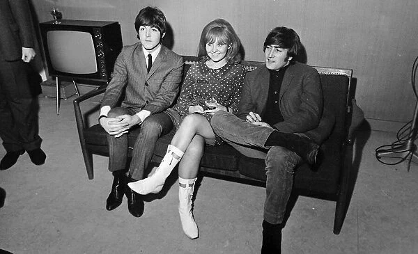 John Lennon and Paul McCartney with Lulu sitting on a sofa during the making of 55 minute