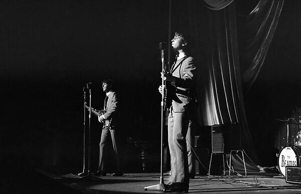 John Lennon and Paul McCartney onstage, during a Beatles gig at the Odeon Cinema