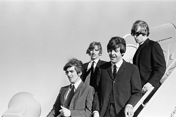 John Lennon, Paul McCartney, Ringo Starr and George Harrison of The Beatles walking down
