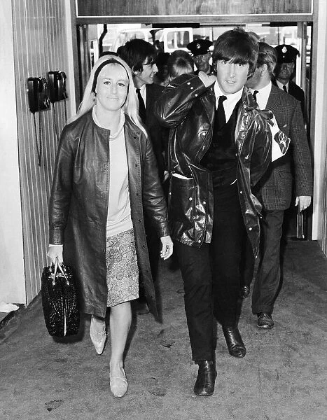 John Lennon with wife Cynthia Lennon leaving the Pam American (Pan Am