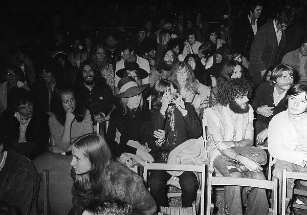John Lennon and Yoko Ono are anonymous in the audience at the Bob Dylan performance at