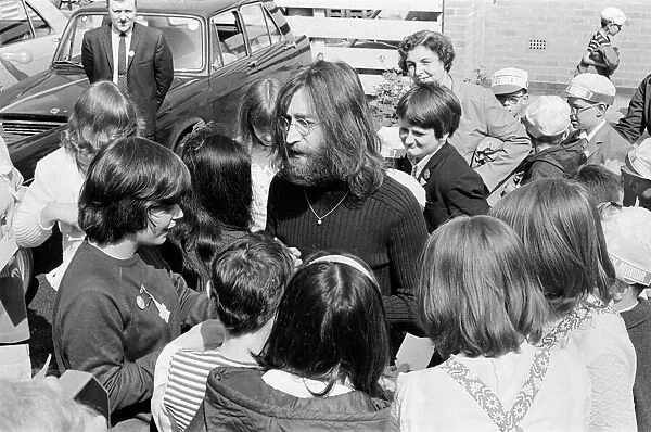 John Lennon and Yoko Ono greeting fans before a trip up to Durness