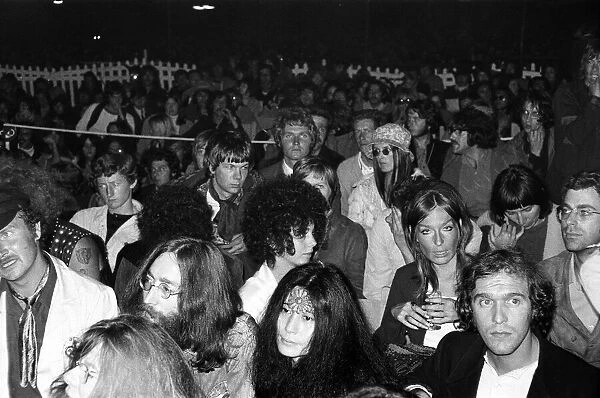 John Lennon and Yoko Ono pictured in the audience of the Isle of Wight pop festival