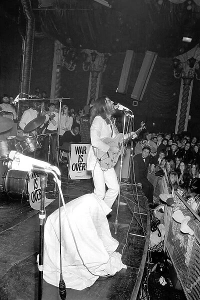 John Lennon and yoko Ono on stage at the Lyceum. John was playing live for