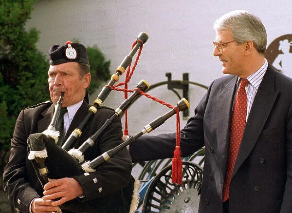 John Major with piper Billy Marshall while electioneering in Gretna Green April 1997