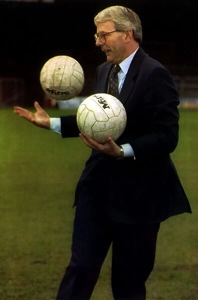 John Major playing with two footballs at Ednburgh