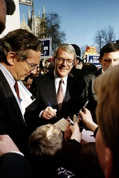 John Major Prime Minister signs a boys wage packet at Selby during the 1992 elections