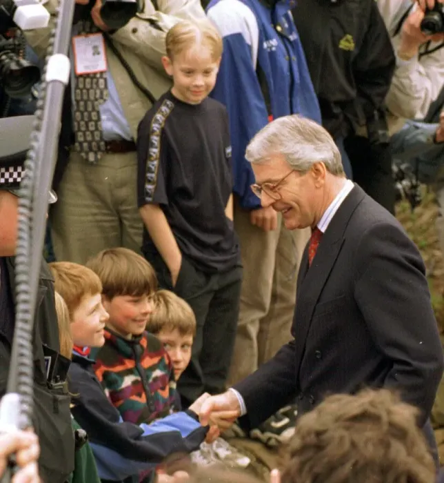 Framed Print : John Major shaking hands with small boy during his visit to Gretna Green April 1997