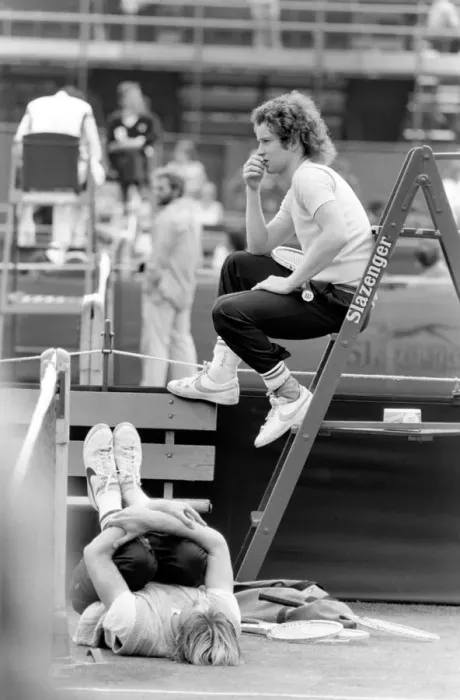 Framed Print : John McEnroe, with a foot bandaged and leather support seen here during training running