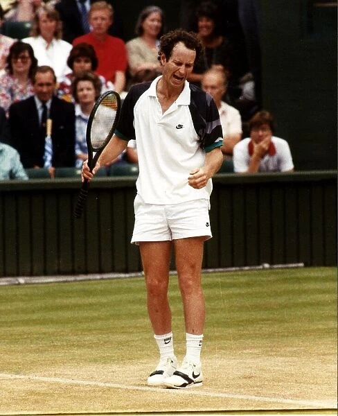 John McEnroe tennis champion in action angry with himself