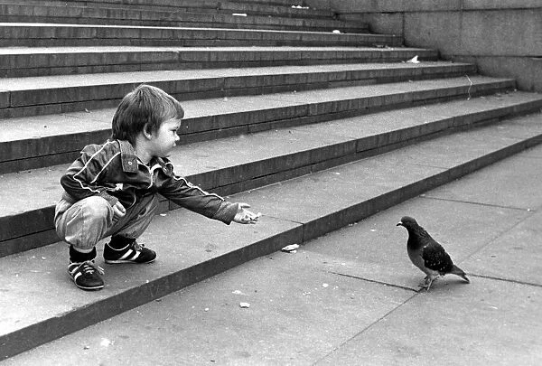 John Milller feeding a pigeon in Trafalger Square. September 30th 1983