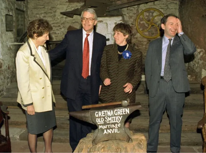 Framed Print : John and Norma Major with Michael Forsyth and wife Susan at the marriage anvil in the old