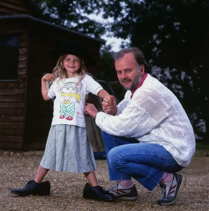 Framed Print : John Peel DJ Disc Jockey July 1987 with one of his children Florence