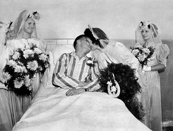 John Shippen and Pauline kiss after their wedding in a hospital ward
