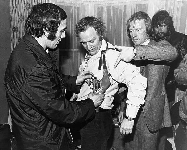 John Thaw getting fitted up with his gun prior to filming of The Sweeney with Dennis