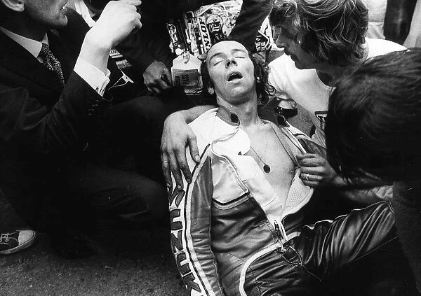 John Williams exhausted after pushing his bike for the last mile in the 1976 TT 500cc