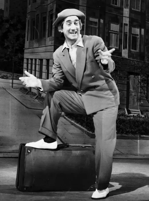 Framed Print : Johnny Beattie comedian comic actor on stage foot on suit case pointing back drop Framed Print : Johnny Beattie comedian comic actor on stage foot on suit case pointing back drop